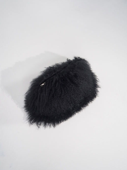 Black fluffy pouch on a white background